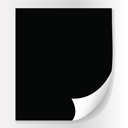 black sheet of paper with a curved edge on a light background