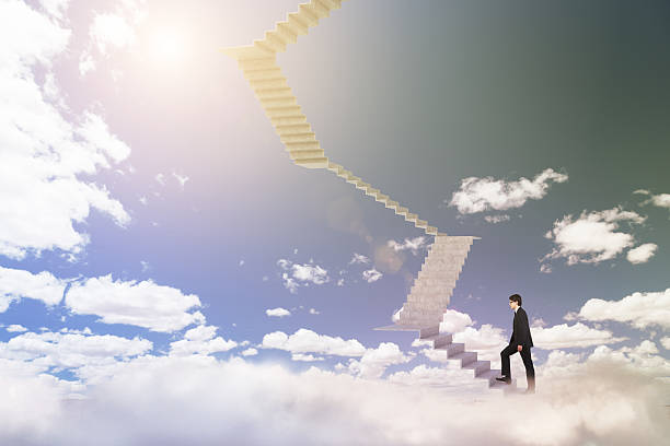 istock Businessman climbing upstairs 517422154