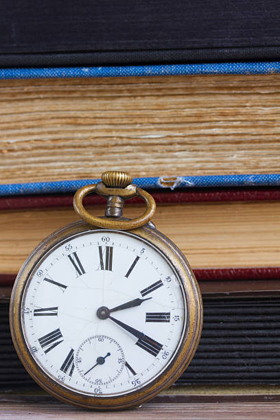 istock antique clock on books background 517422551