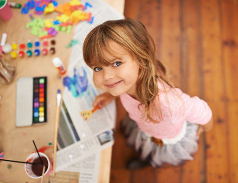 Shot of an adorable little girl doing arts and crafts