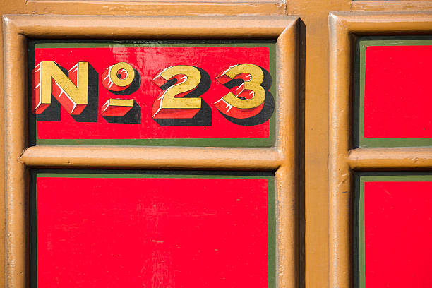 istock Number 23 - train door number in bright red gold 517444853