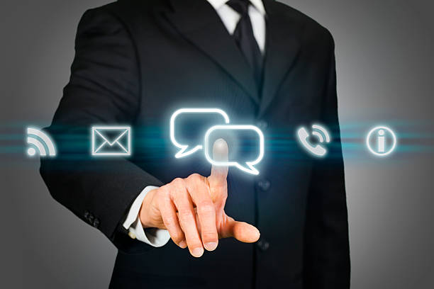 istock Businessman clicking on live chat icon 517446989