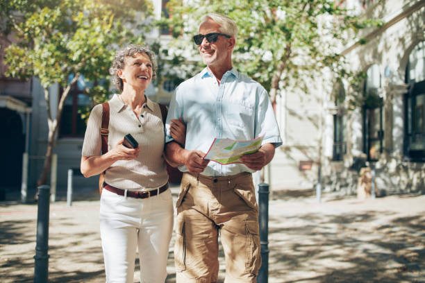 istock Senior couple with a map walking in the town. 517458196
