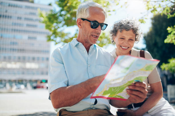 istock Senior couple looking at city map 517458262
