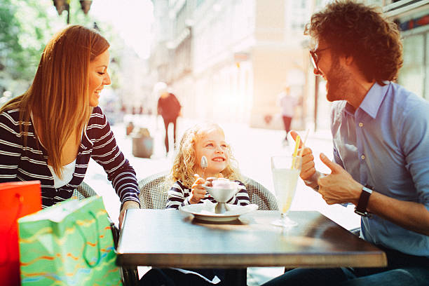 istock Family Enjoy Outdoors in A Cafe. 517458426