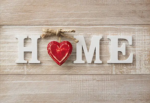 Wooden "home" text on vintage board with copy space 