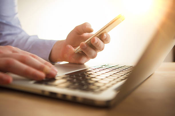 istock The male hand holding a phone 517460214