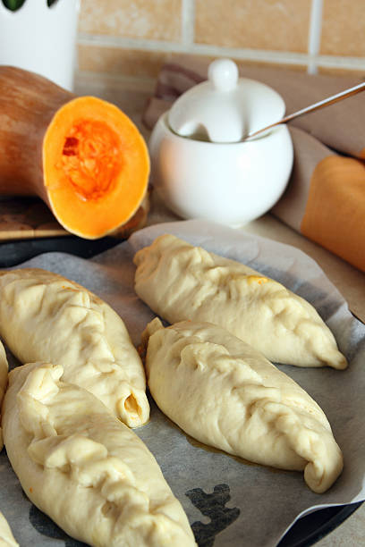 istock Homemade cakes with pumpkin filling before baking.. 517460234