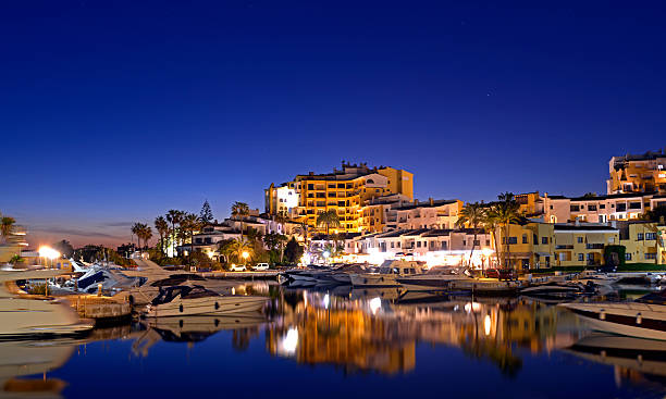 istock Cabopino port Spain.  At nightime. 517460306