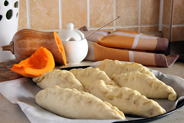 istock Homemade cakes with pumpkin filling before baking.. 517460396