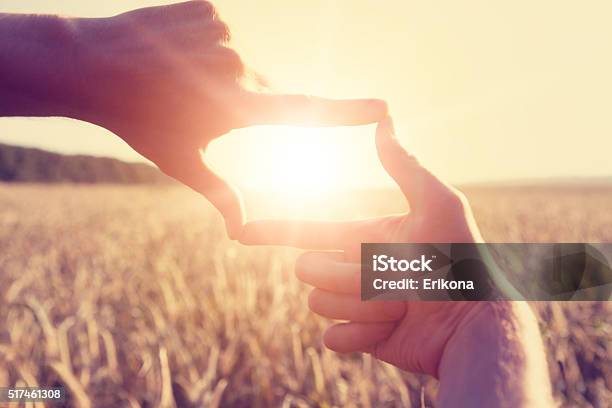 Hands Framing Distant Sun Rays Stock Photo - Download Image Now - Forecasting, Strategy, Focus - Concept