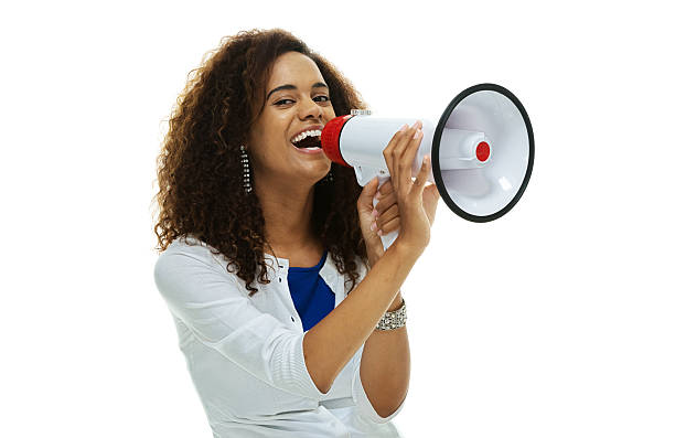 istock Cheerful woman shouting with megaphone 517463960