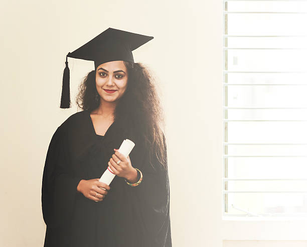 istock Female Graduate in Academic Gown 517464034