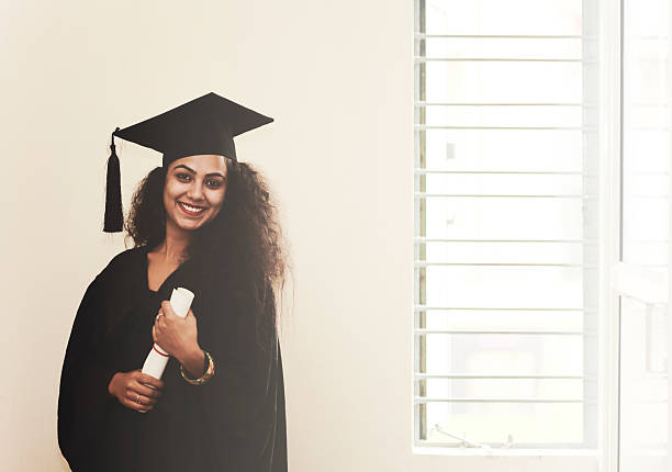 istock Female Graduate in Academic Gown 517464132