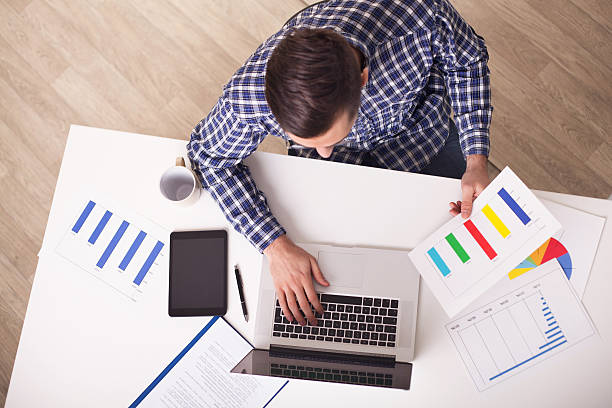 istock Above view of businessman working in the office. 517464376