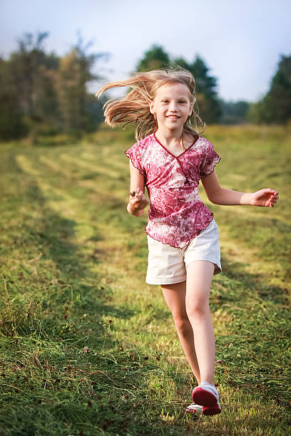 istock Little girl on the meadow. 517464771