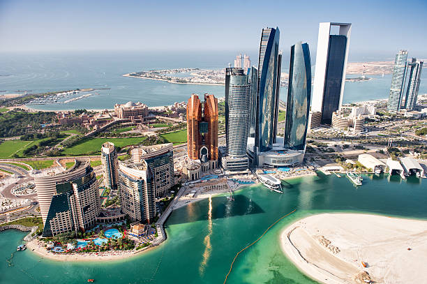Famous buildings in Abu Dhabi Part of Abu Dhabi, UAE with tall buildings and surrounding area viewed from the helicopter. Many details are visible in the image. persian gulf countries stock pictures, royalty-free photos & images