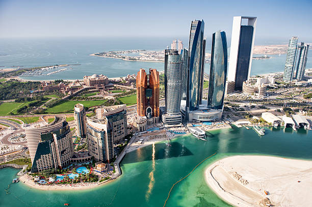 Famous buildings in Abu Dhabi Part of Abu Dhabi, UAE with tall buildings and surrounding area viewed from the helicopter. Many details are visible in the image. gulf countries stock pictures, royalty-free photos & images