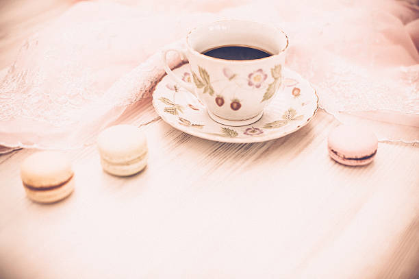 istock Cup of coffee with macarons 517465572