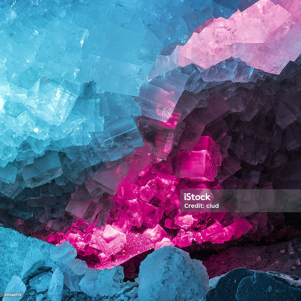 Blue and Purple Salt Crystals in a Crystal Cavern Salt crystals and light effects in a crystal cave (potash mine Merkers, Thuringia, Germany) Crystal Stock Photo