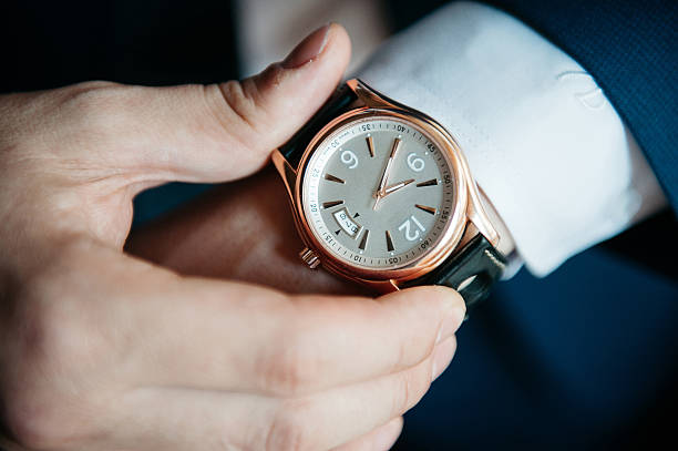 istock men's watch on his hand close-up 517465948