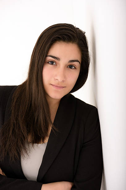 istock Young confident business woman in suit looking at camera 517466340