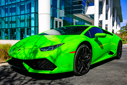 Sarasota, FL, USA - February 20, 2016: Bright green 2015 Lamborghini Huracan sports car  in a parking lot in Sarasota Florida