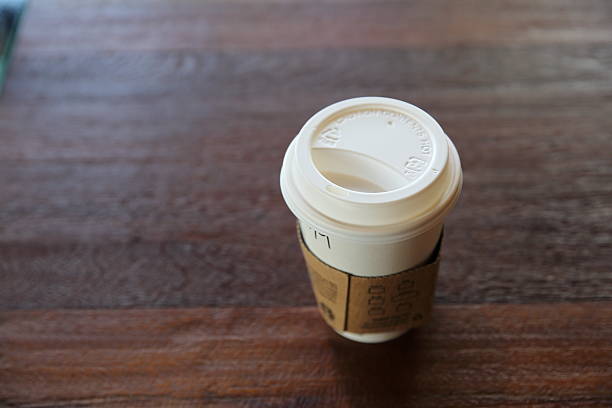 istock cup of coffee on wood background 517466848