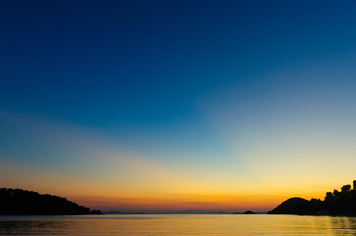 Panormos bay with nice beach on Greek island Skopelos in Aegean Sea, located on south-west side of island at sunset