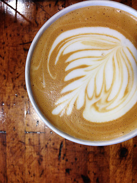 istock Foam coffee design close up on wood table 517469905