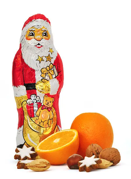 chocolate santa clause with orange, cinnamon stars and nuts