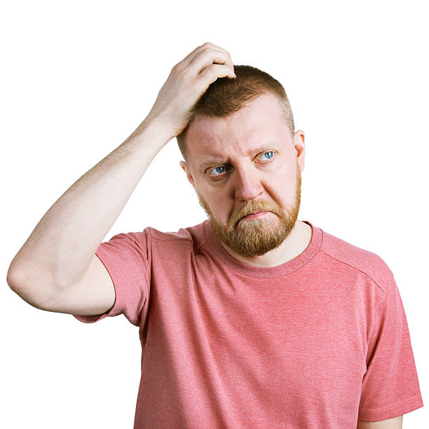 istock Man scratches his head in doubt 517471358