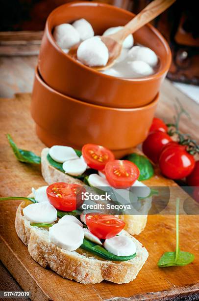 Mozzarella Tomatoes And Bread Stock Photo - Download Image Now - Appetizer, Basil, Bread