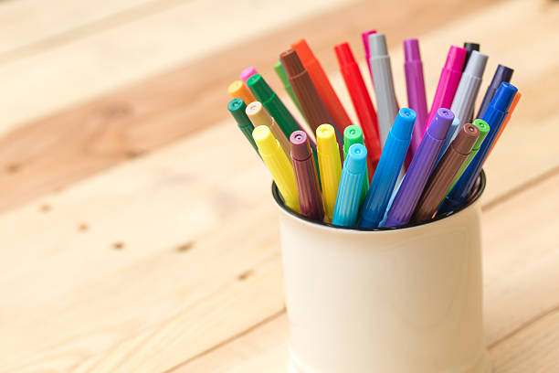 color pen on wood table background with copy space, artist working space concept.