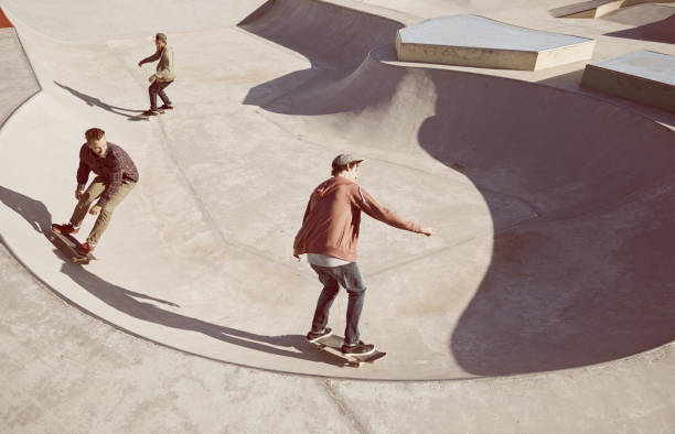 Follow the leader Young men skating at a skate park x games stock pictures, royalty-free photos & images