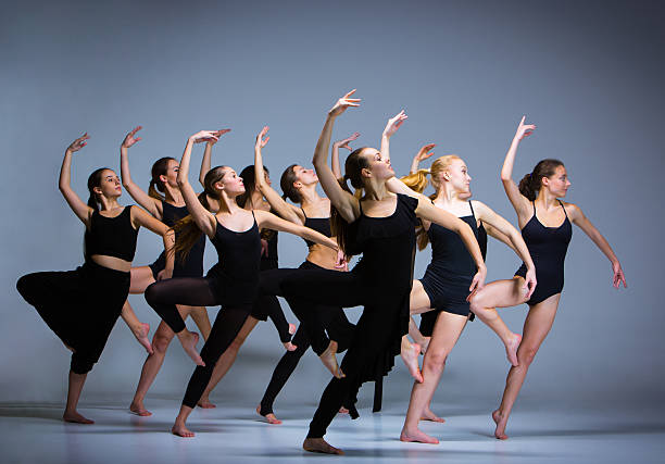 The group of modern ballet dancers The group of modern ballet dancers dancing on gray background child art people contemporary stock pictures, royalty-free photos & images