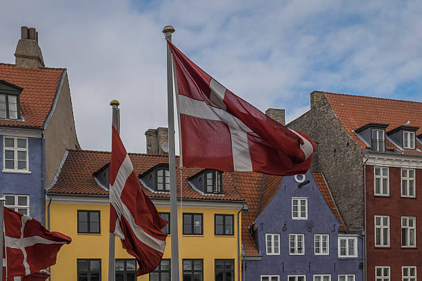 Danish flags fluttering in the wind on Nyhaven in central Copenhagen