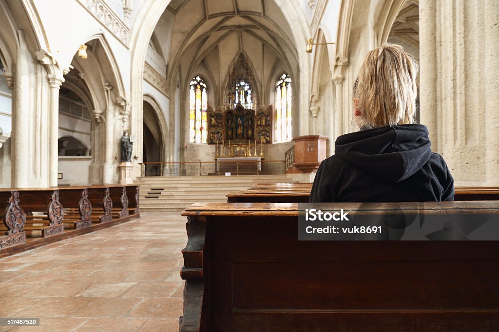 Prayer Young woman praying in the church, Nonnberg Monastery, Salzburg. Confession Booth Stock Photo