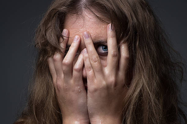 istock Frightened girl in water droplets 517488213