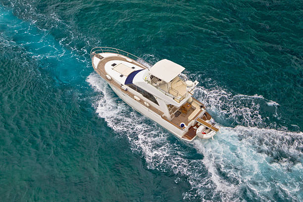 istock Yacht sailing on sea aerial view 517488887