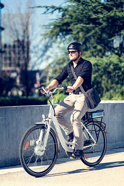 istock Young businessman on electric bicycle 517489063