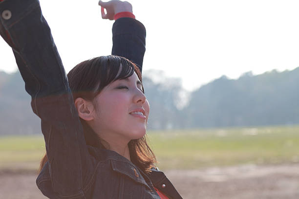 young Japanese woman breathing fresh air