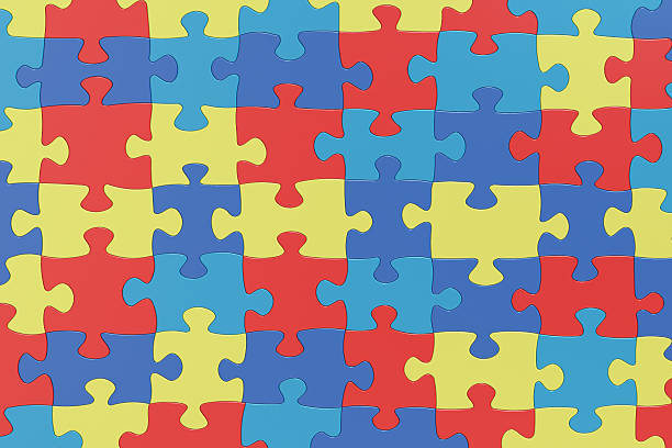 istock Puzzle Pieces in Autism Awareness Colors Background, 3D renderin 517490922