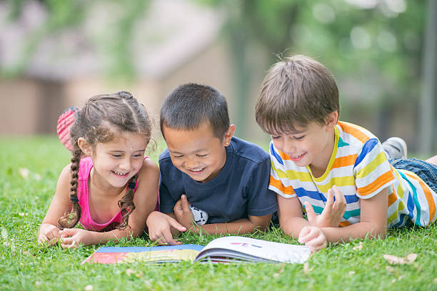 istock Students Reading a Book at the Park 517491202