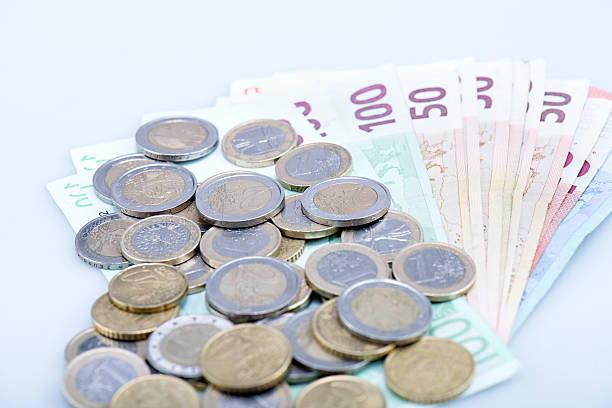 istock European banknotes with coins 517493036
