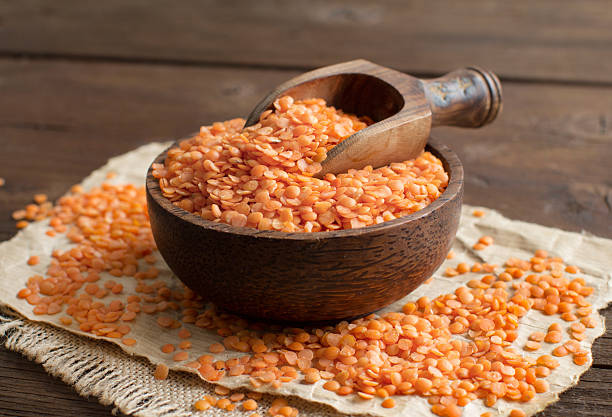 istock Red lentils in a bowl with a spoon 517493270