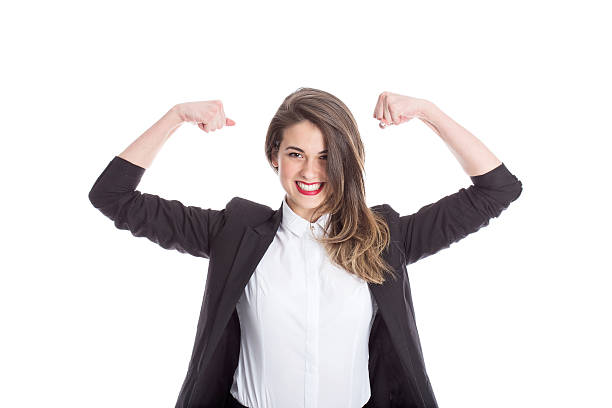 Businesswoman Flexing Muscles Enthusiastic businesswoman flexing her muscles; isolated on white. flexing muscles stock pictures, royalty-free photos & images