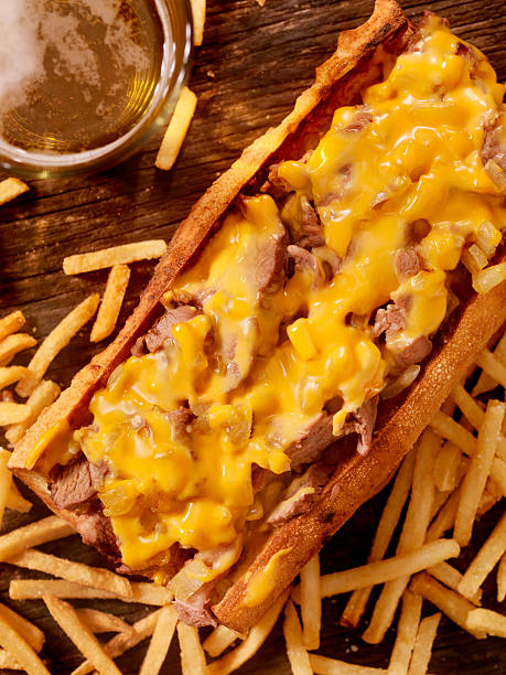 istock Philly Cheese Steak Sandwich with Fries and a Beer 517499010
