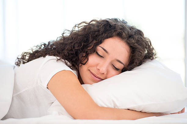 istock Close-up of sleeping happy woman 517499081