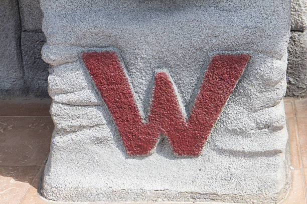 istock W toilet sign on stone 517499169